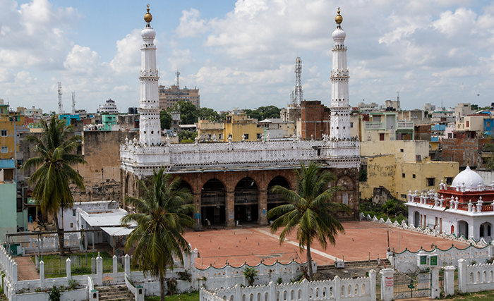 Historic mosque with minarets and courtyard