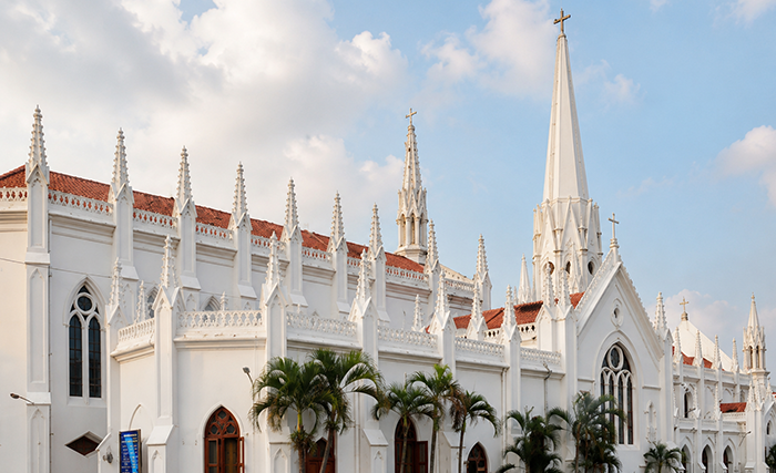White neo-Gothic church with tall spire