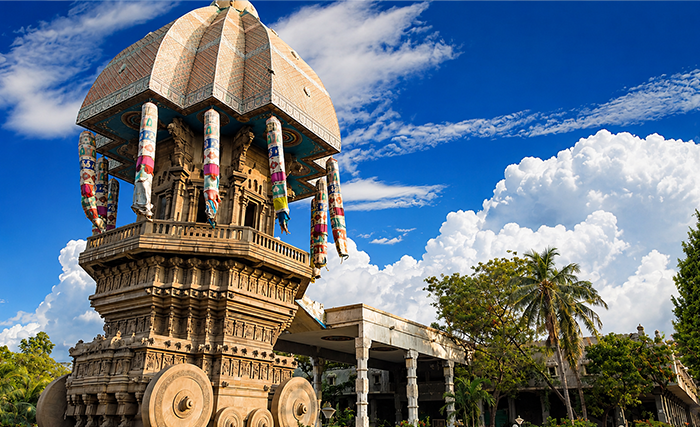 Large stone chariot monument under blue sky